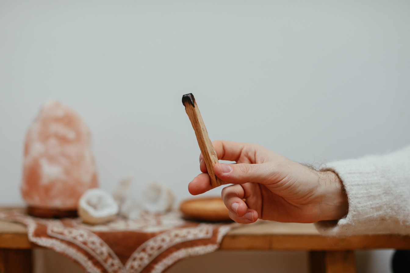 A Person Holding a Palo Santo
